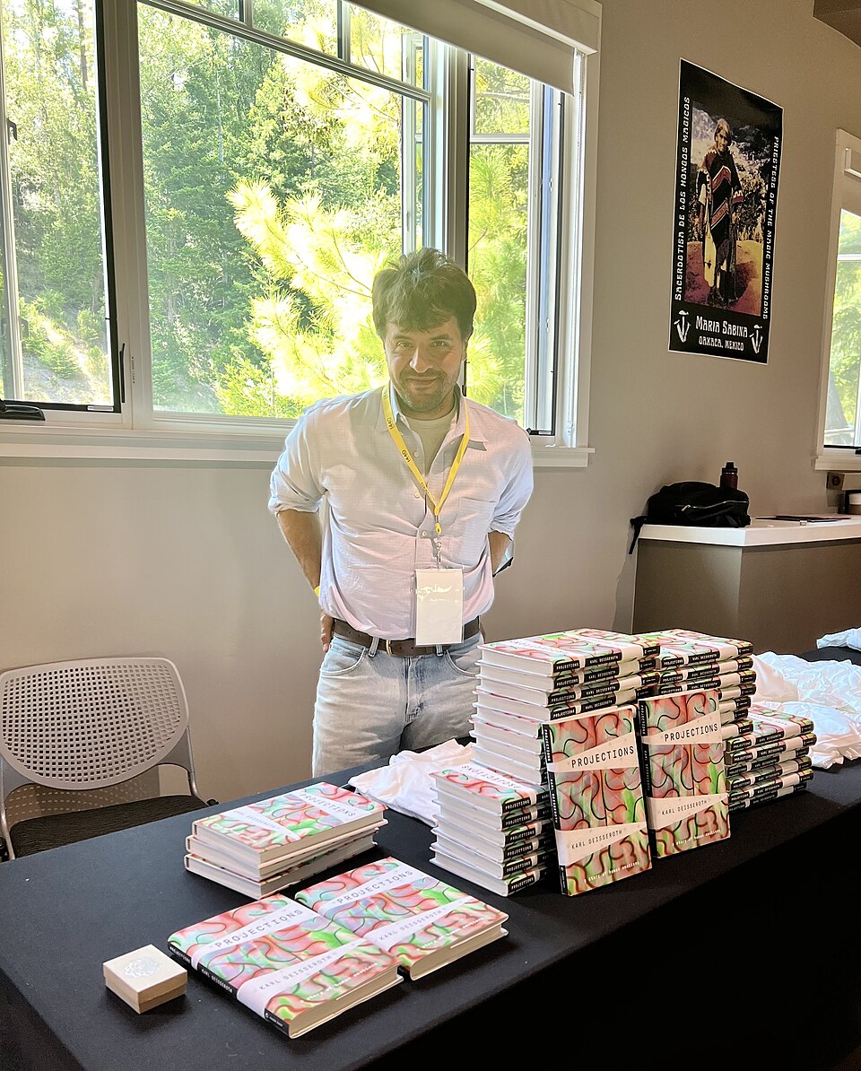 Karl Deisseroth beside copies of his book Projections at the PSFC Summit, 23 May 2022. Resized for this gallery.